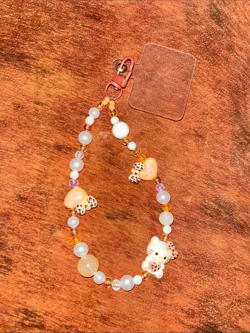 Cute Orange Pearl Hello Kitty Charm Wristlet